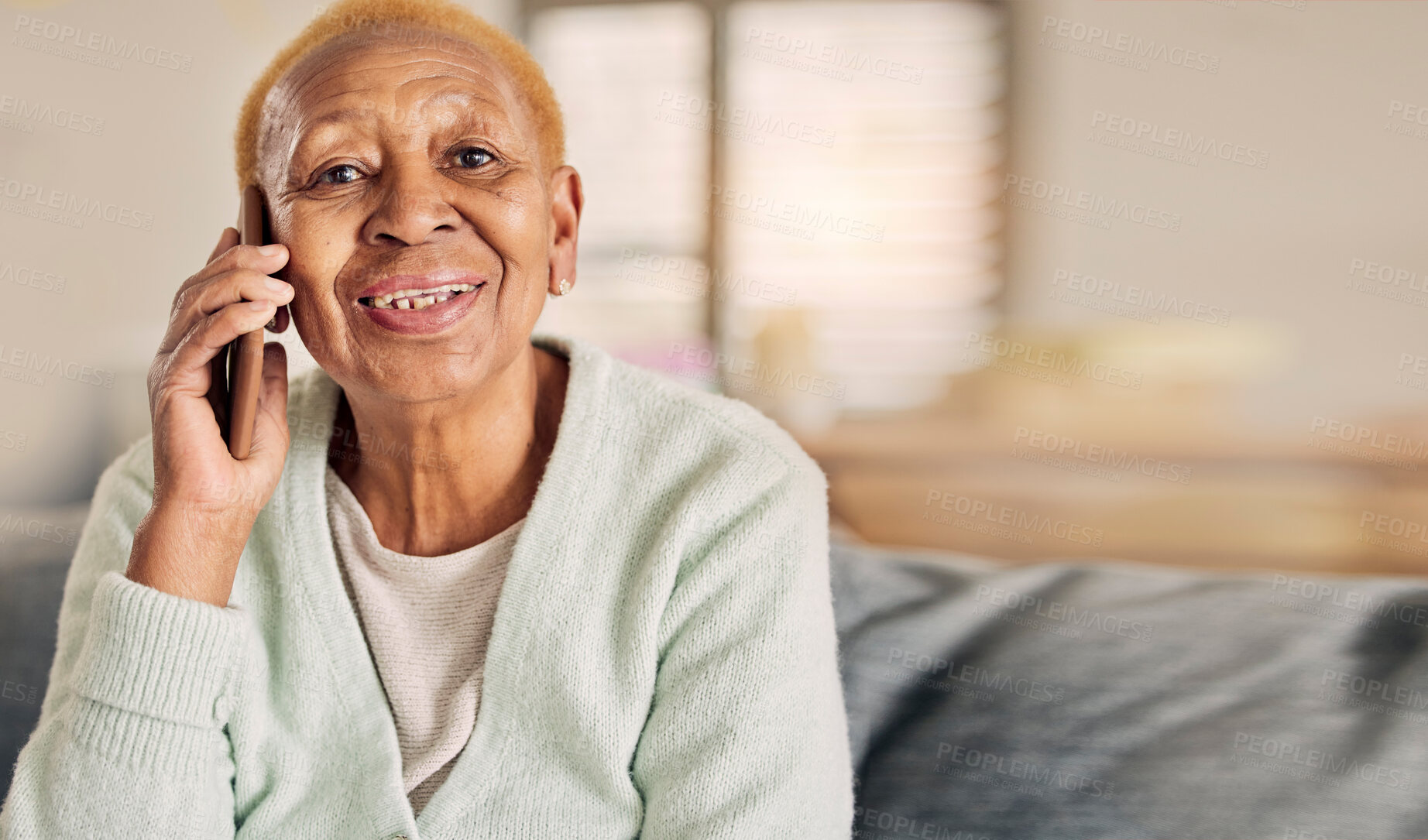 Buy stock photo Phone call, senior woman portrait and living room with conversation and communication in a home. Retirement, African elderly person and mobile discussion on a lounge sofa with contact and talking