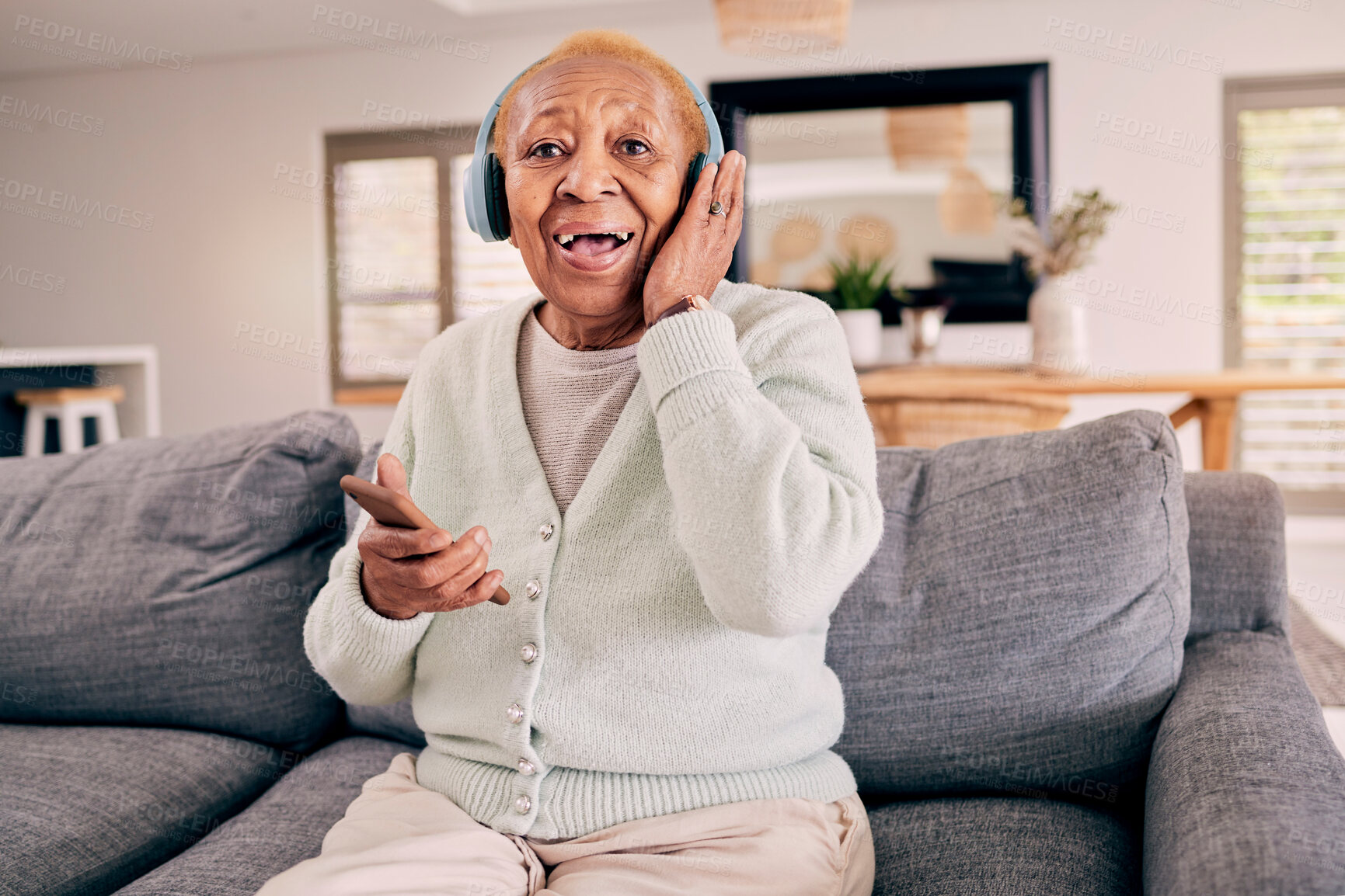 Buy stock photo Headphones, relax and portrait of senior woman on sofa in home listening to music, audio and radio. Retirement, technology and person in living room on phone for streaming track, song or subscription