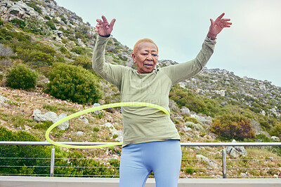 Senior fun, game and black woman with a hula hoop for sports, exercise or cardio in nature. Happy, elderly and an African person training with a toy for a workout, recreation or hobby on the weekend