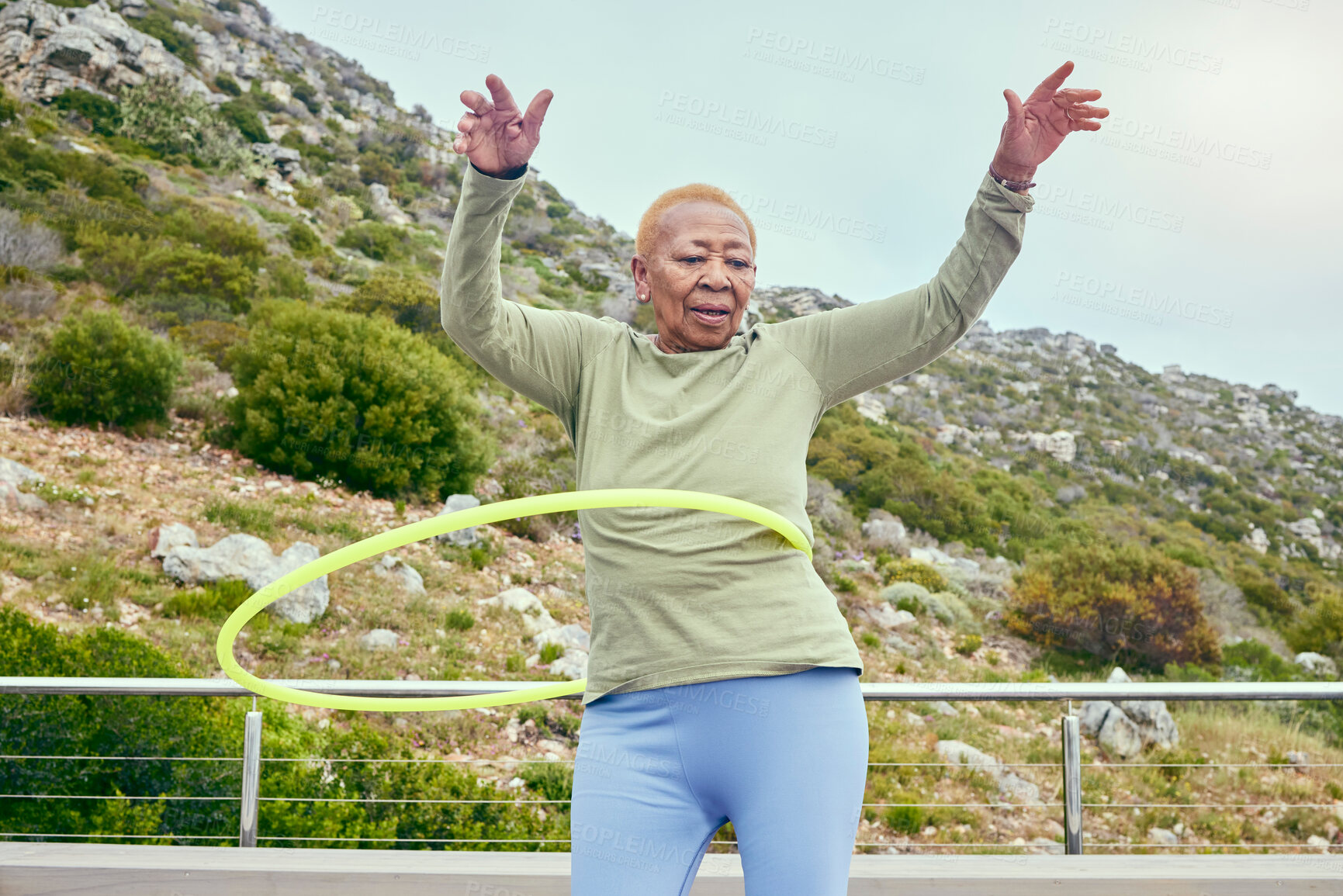 Buy stock photo Senior fun, game and black woman with a hula hoop for sports, exercise or cardio in nature. Happy, elderly and an African person training with a toy for a workout, recreation or hobby on the weekend