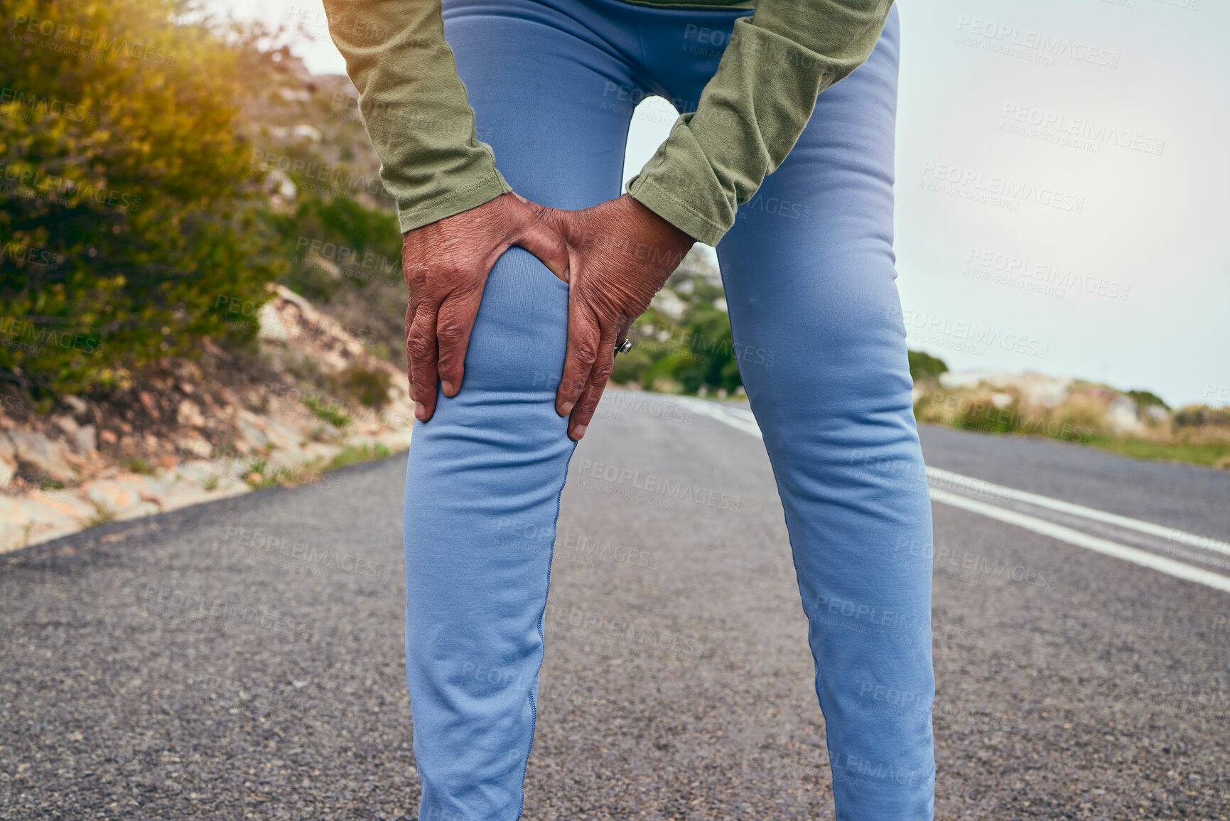 Buy stock photo Knee pain, road and fitness of a senior person with massage and sport injury from exercise. Street, running and path of a athlete with joint inflammation, muscle issue and hands on leg outdoor