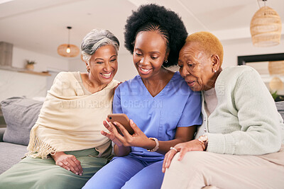 Buy stock photo Phone, caregiver and elderly women on sofa to browse internet, telehealth and mobile app together. Retirement, nursing home and nurse with senior people on smartphone for medical result or report