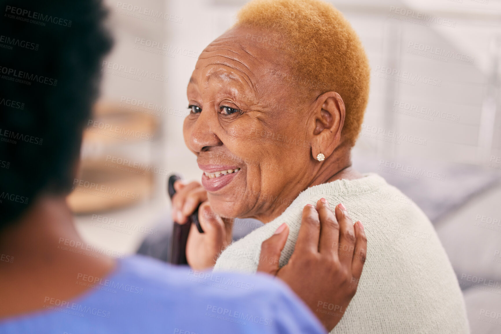 Buy stock photo Smile, talking and a senior woman with a caregiver for medical attention, care and support in a home. Happy, love and an elderly patient with healthcare, communication or service from a nurse