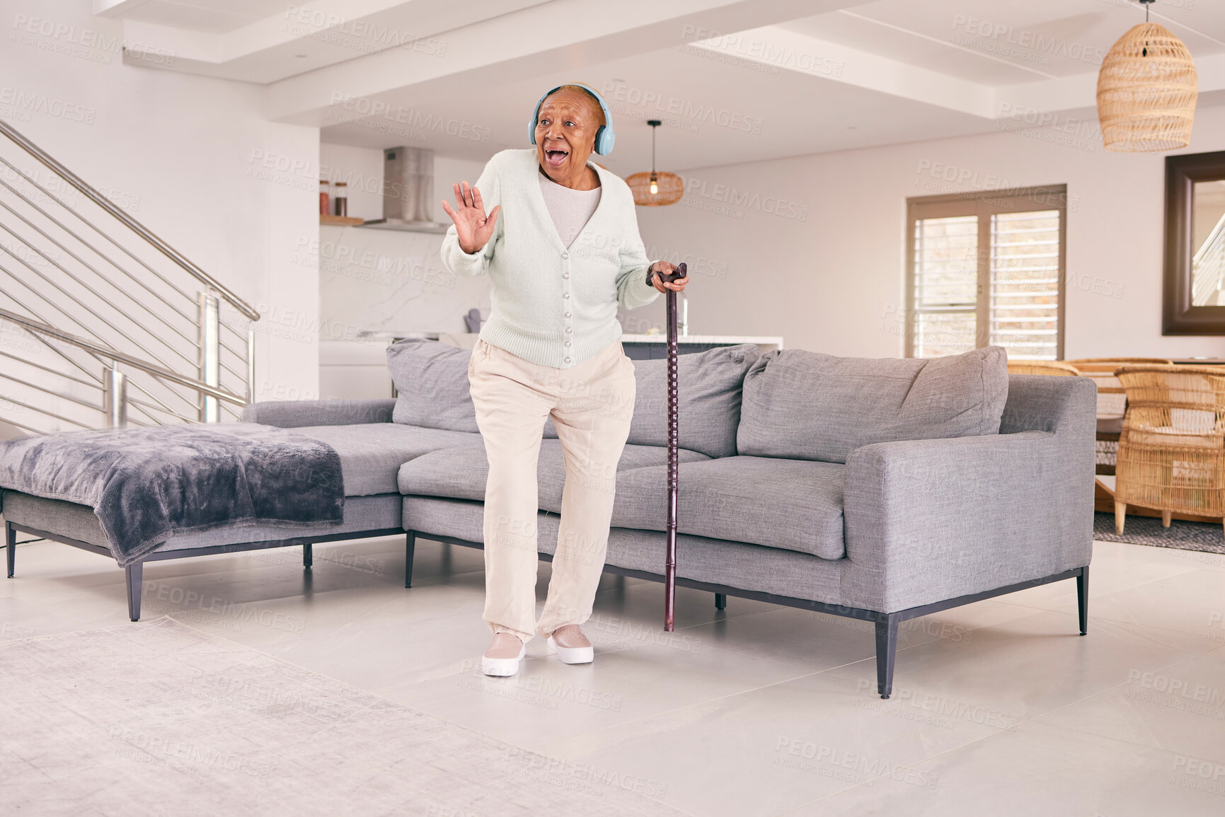 Buy stock photo Living room, dancing and happy senior woman with headphones enjoy music and excited for retirement in her home. Happiness, freedom and elderly person listening to radio, audio and song with smile