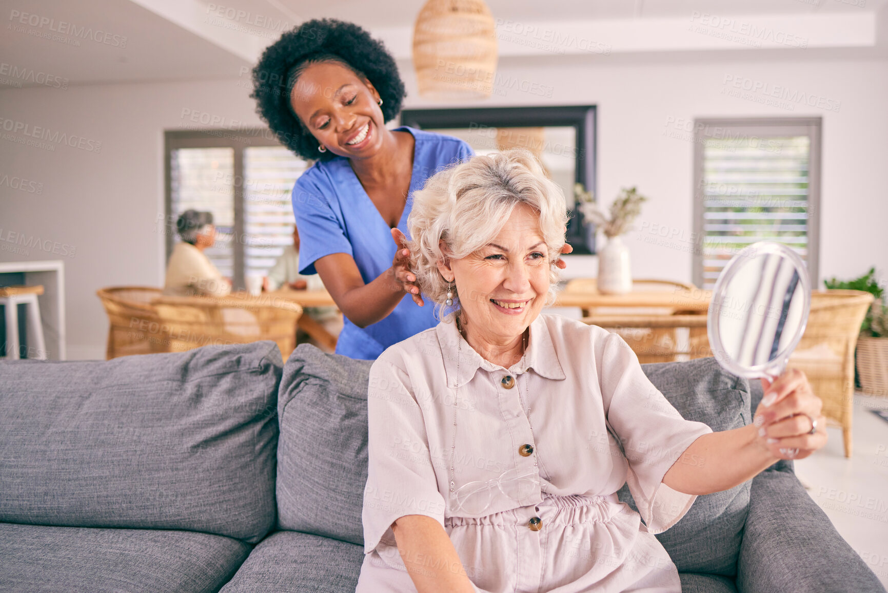 Buy stock photo Nurse brush hair of senior woman in the living room of the modern retirement home for self care. Mirror, routine and African female caregiver doing a hairstyle for an elderly patient in the lounge.