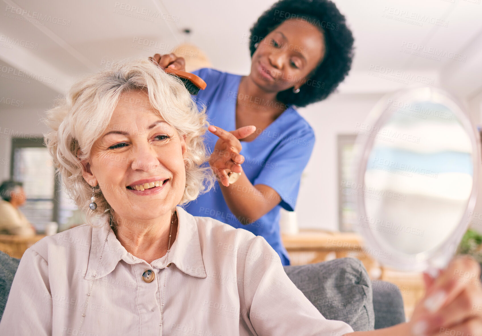 Buy stock photo Caregiver brush hair of happy senior woman in the living room of the modern retirement home for self care. Mirror, routine and African female nurse doing a hairstyle for an elderly patient in lounge.