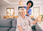 Nurse brush hair of happy mature woman in the living room of the modern retirement home for self care. Mirror, routine and African female nurse doing a hairstyle for an elderly patient in the lounge.