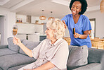 Caregiver brush hair of senior woman in the living room of the modern retirement home for self care. Mirror, routine and African female nurse doing a hairstyle for an elderly patient in the lounge.