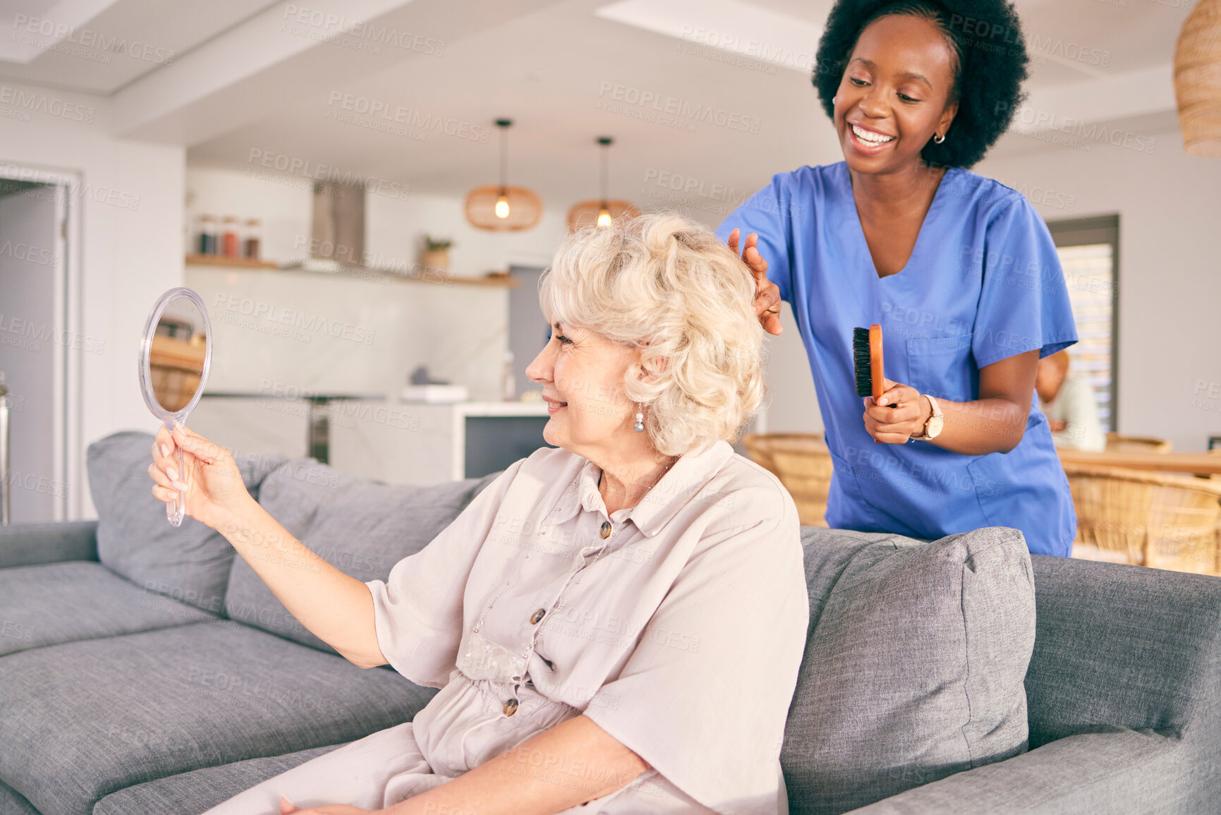 Buy stock photo Caregiver brush hair of senior woman in the living room of the modern retirement home for self care. Mirror, routine and African female nurse doing a hairstyle for an elderly patient in the lounge.