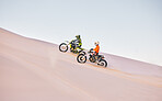 Dune, off road race and men on motorbike together for practice, training and extreme sports energy. Professional dirt biking challenge, friends and danger with motorcycle competition on desert hill.