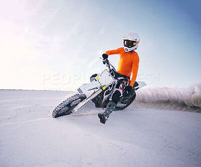 Buy stock photo Bike, sand and speed with a man on mockup riding a vehicle in the desert for adventure or adrenaline. Motorcycle, training and freedom with an athlete on space in nature for power or extreme sports