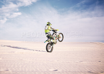 Buy stock photo Bike, space and balance  with a sports man riding a vehicle in the desert for adventure or adrenaline. Motorcycle, training or freedom and an athlete on sand in nature for skill or power with mockup