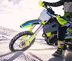 Sports, desert and person on motorbike in nature for training, workout and challenge on sand. Extreme transport, travel and closeup of cyclist with motorcycle for adventure, freedom and adrenaline