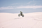 Bike, mockup and balance with a man in the desert riding a vehicle for adventure or adrenaline. Motorcycle, space and training on sand with an athlete outdoor in nature for freedom or active power