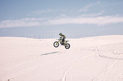 Buy stock photo Bike, mockup and balance with a man in the desert riding a vehicle for adventure or adrenaline. Motorcycle, space and training on sand with an athlete outdoor in nature for freedom or active power