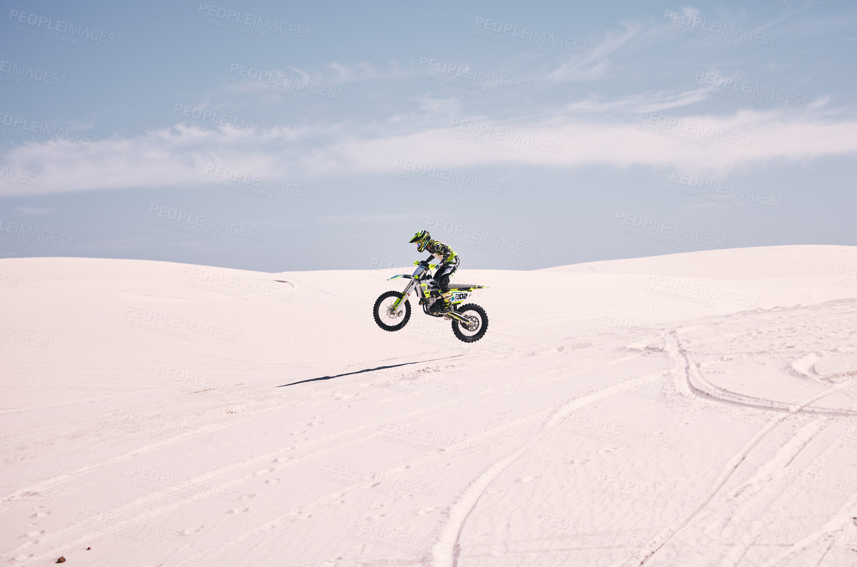 Buy stock photo Bike, mockup and balance with a man in the desert riding a vehicle for adventure or adrenaline. Motorcycle, space and training on sand with an athlete outdoor in nature for freedom or active power