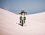 Dune, motorbike and man athlete training in desert for extreme sports race or competition. Fitness, sand and male biker on hill for dirt biking challenge, stunt or skill for practice with motorcycle.