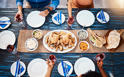 Buy stock photo Wine, food or top of friends in restaurant to relax on holiday vacation at a party event together. Food, group celebration or hands of people eating chicken at table for lunch, dinner or brunch meal