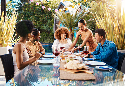 Buy stock photo Friends, food and people outdoor at a table for social gathering, happiness and holiday celebration. Diversity, men and women group eating lunch at party or reunion with drinks to relax in a garden