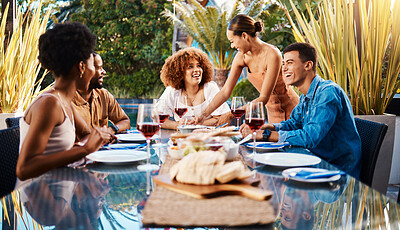 Buy stock photo Friends, people and food outdoor on a table for social gathering, happiness and holiday celebration. Diversity, men and women group eating lunch at a party or reunion with drinks to relax in a garden