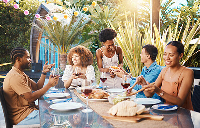 Buy stock photo Group of friends at lunch in garden and talking at happy event with diversity, food and wine. Outdoor dinner, men and women in conversation at table, people eating with drinks in backyard together.