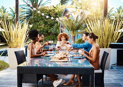 Buy stock photo Group of friends at lunch, fun in garden and happy event with diversity, food and wine, outdoor bonding together. Dinner party, men and women at table, people eating with drinks in backyard in summer