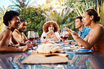Happy people at table, lunch in garden and conversation happy event with diversity, food and wine. Outdoor dinner party, men and women together, friends eating with talking in backyard in summer.