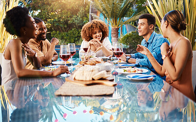 Friends, food and outdoor table for holiday, Christmas or thanksgiving lunch and wine at backyard patio. Young people or social group with alcohol, brunch and drink or talking of summer vacation