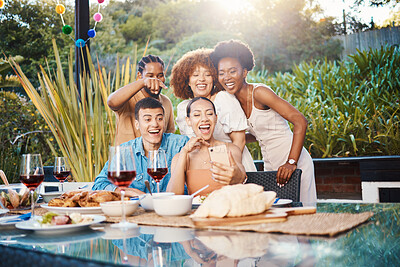 Selfie, group of friends at dinner in garden and happy event with diversity, food and wine at outdoor party. Photography, men and women at table, fun people with drinks in backyard at sunset together