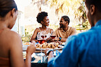 Wine, happy and friends at outdoor restaurant to relax on holiday vacation in summer together. Food, smile or black people eating or bonding at table in conversation on date for lunch or brunch meal