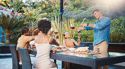 Cheers, celebrate, and friends at dinner in garden at party and diversity, food and wine at outdoor event. Glass toast, men and women at table, fun people with sunset drinks in backyard together.