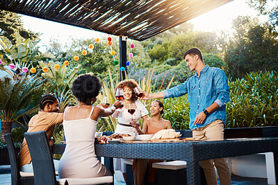 Buy stock photo Cheers, wine and friends at dinner in garden at party and celebration in diversity, food and alcohol at outdoor event. Glass toast, men and women at table, fun people with drinks in backyard together