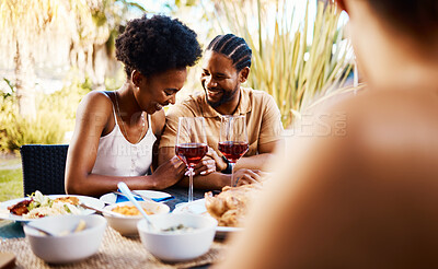 Buy stock photo Conversation, friends at dinner in garden at party and celebration with diversity, food and wine at outdoor lunch Eating, men and women at table, fun people talking with drinks in backyard together.