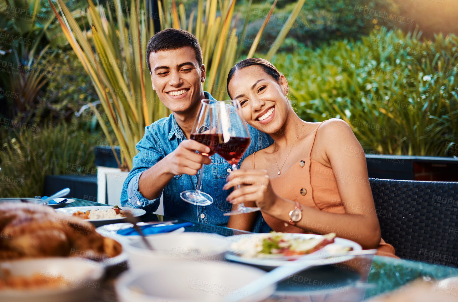 Buy stock photo Portrait, happy couple and toast with wine glass at restaurant, bonding and having fun. Face, alcohol and man and woman cheers at dinner party, celebration date and drink together at outdoor table