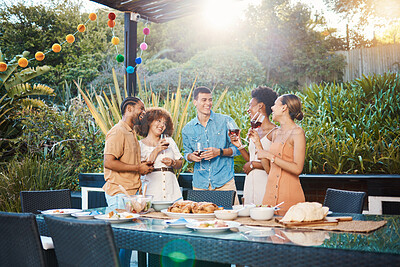 Buy stock photo Smile, diversity and friends at lunch in a garden with drinks, conversation and talking at a party. Happy, alcohol and group of men and women at an outdoor backyard dinner with communication
