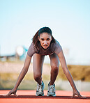 Woman, portrait and start of running athlete in sports fitness, exercise or motivation on stadium track. Serious female person or runner ready in race, sprint marathon or cardio workout and training