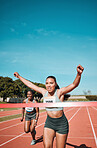 Happy woman, running and winning by finish line in race, competition or marathon on outdoor stadium track. Female person or runner in celebration for victory, achievement or sports accomplishment