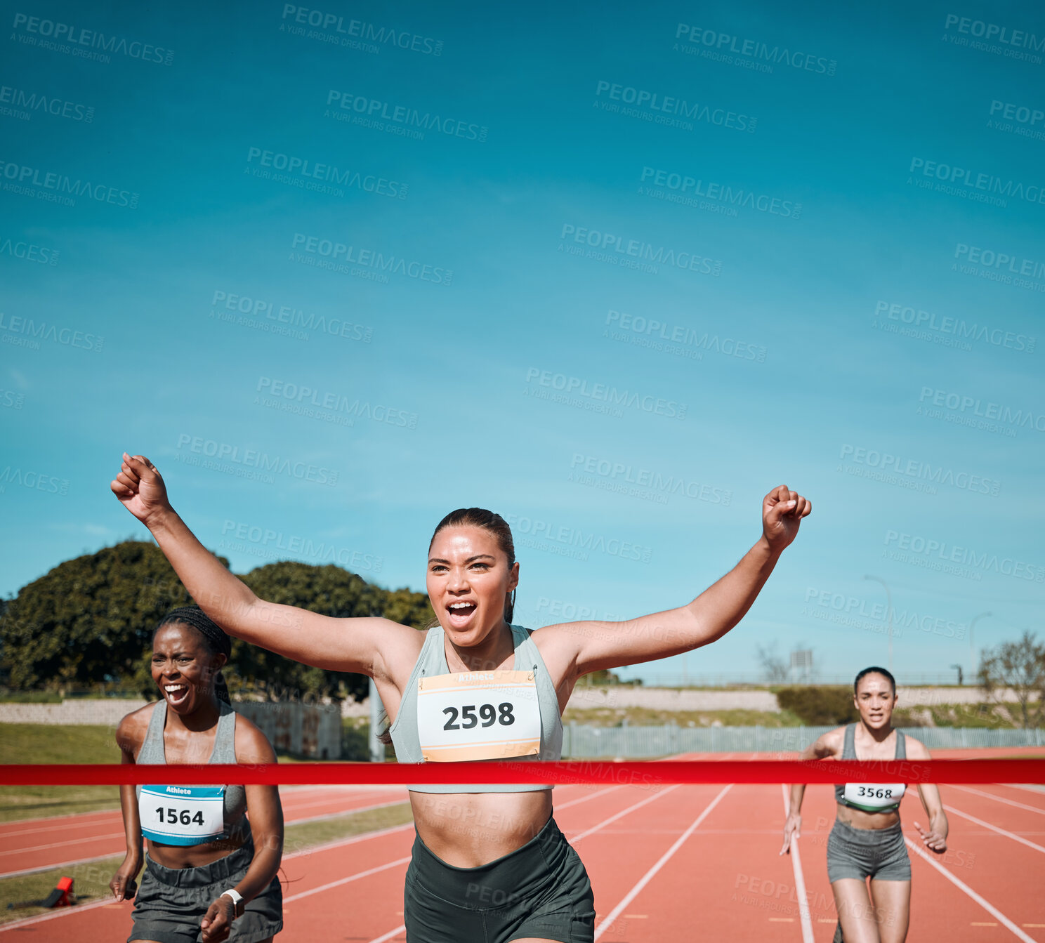 Buy stock photo Happy woman, running and winning by finish line in competition, race or marathon on outdoor stadium track. Person or runner in celebration for victory, achievement or sports challenge on mockup space