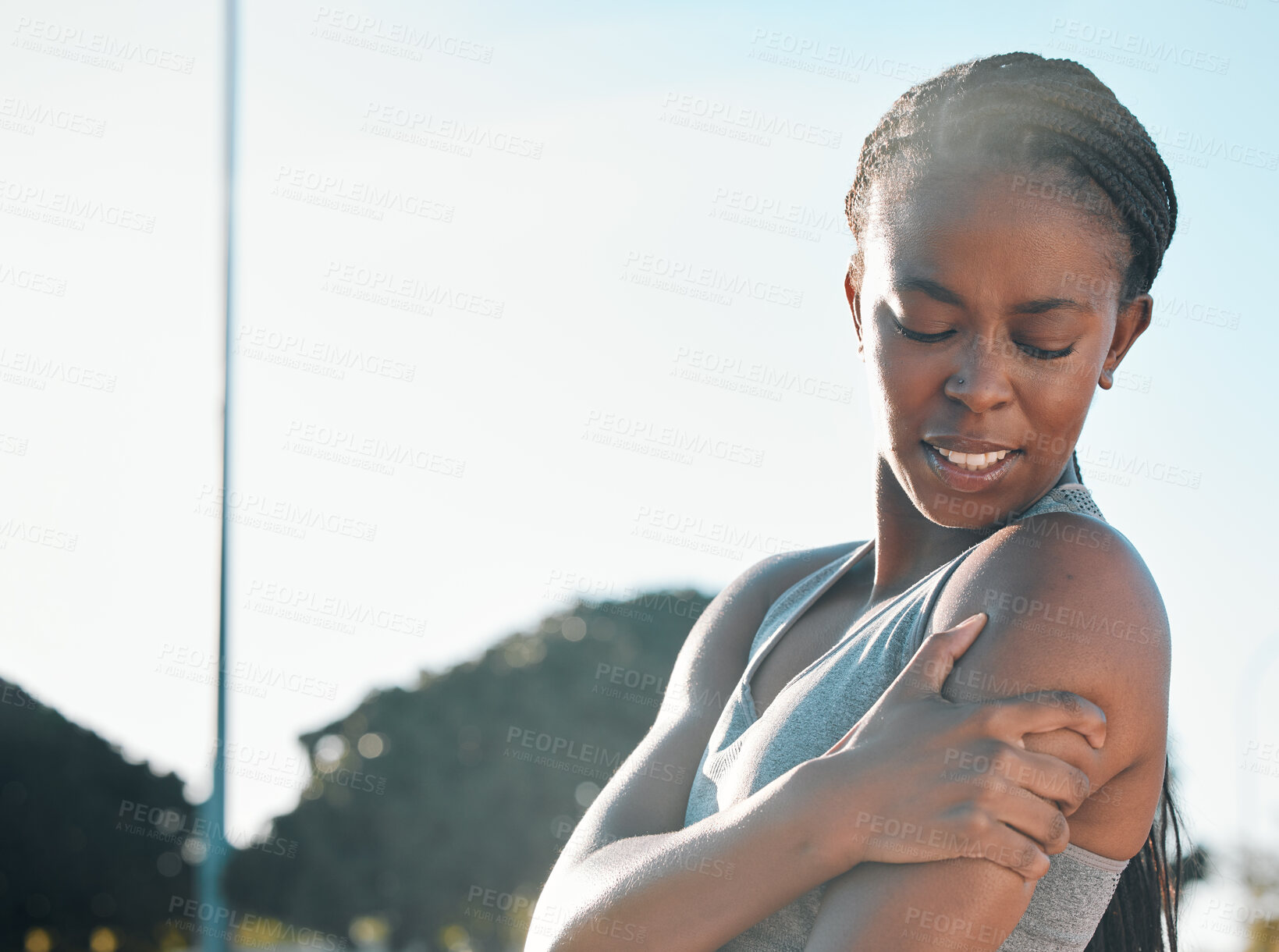 Buy stock photo Fitness, running and a black woman with pain in arm from outdoor exercise, training and field sports. Accident, young and an African athlete with a muscle injury from a workout, cardio or emergency