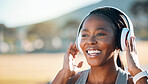 Headphones, mockup and black woman at fitness training or outdoor workout for health wellness and enjoy music. Smile, African and athlete or person streaming audio or radio for exercise in a park