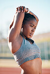 Sports, exercise and woman stretching outdoor at a stadium for workout, training and warm up. African athlete person for muscle stretch, fitness and wellness or flexibility for a run or competition