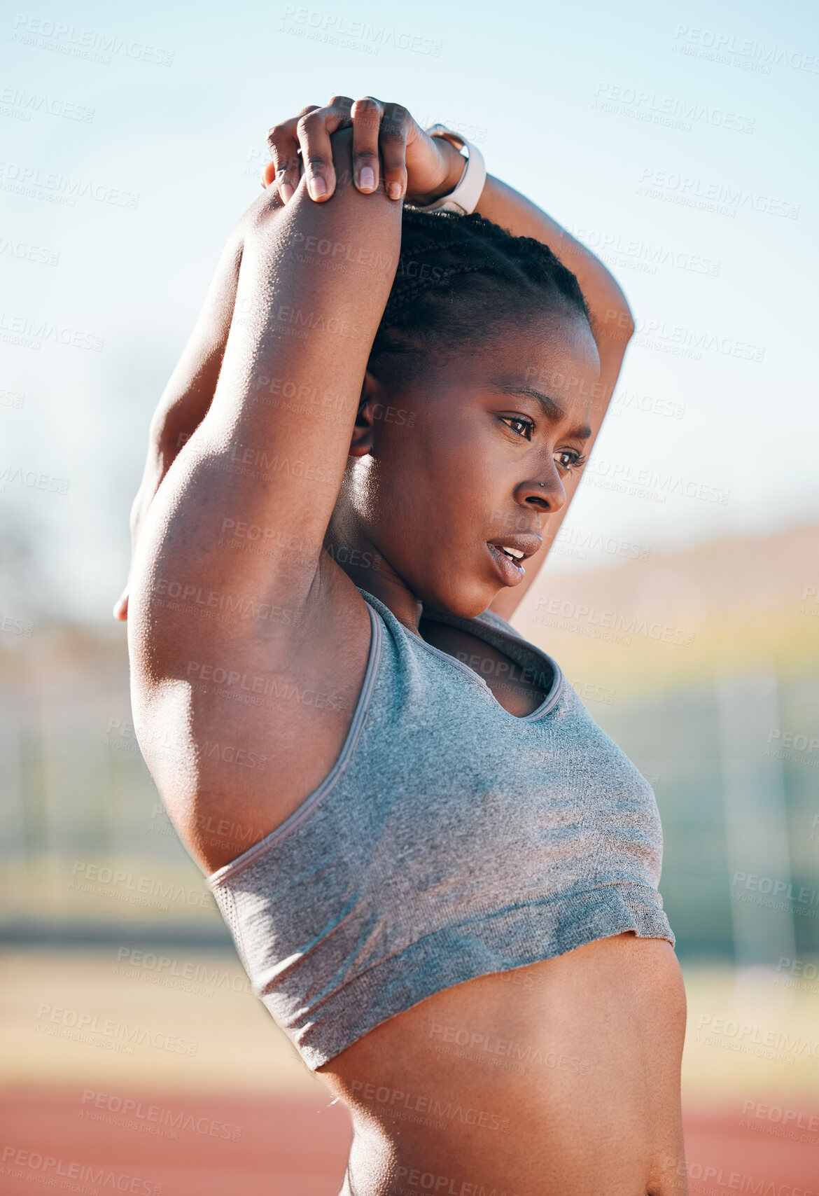 Buy stock photo Sports, exercise and woman stretching outdoor at a stadium for workout, training and warm up. African athlete person for muscle stretch, fitness and wellness or flexibility for a run or competition