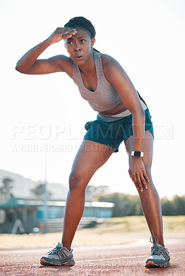 Buy stock photo Sweating, tired and black woman at stadium for a race, training or breathing after cardio. Sports, workout and an athlete or African runner with a break after fitness, running or exercise on a track