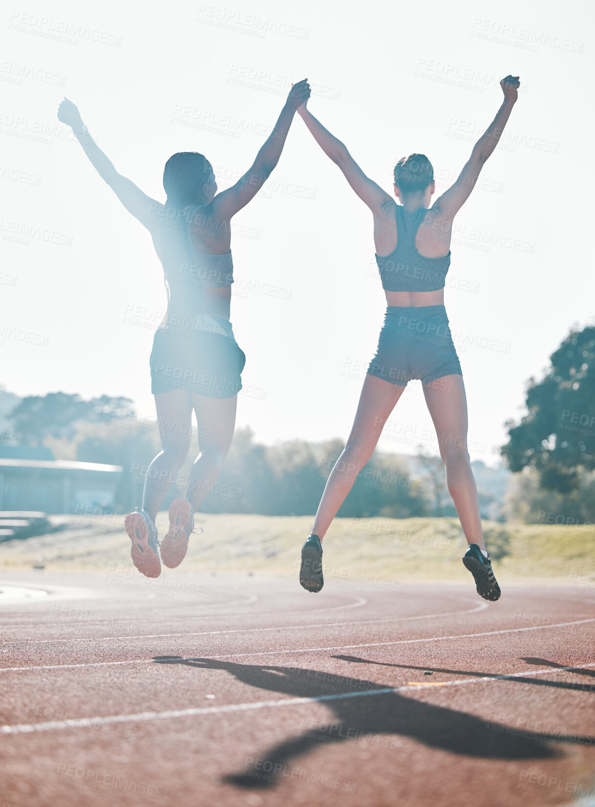 Buy stock photo Friends, fitness and jump, women and celebrate, winning race and energy, wellness and health with support outdoor. Excited, people in air and cardio with sport, success and workout together with back