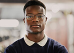 Student, university and portrait of black man on campus for learning, education and vision for future career. Face of African person in library with glasses for research, school project and studying