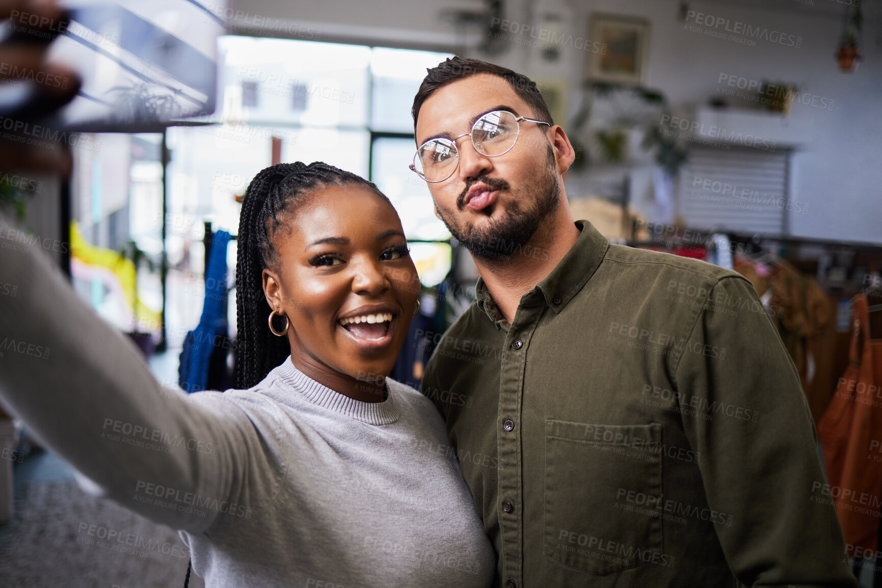 Buy stock photo Couple, bond and selfie of people in clothing store for profile picture, social media and blog on internet. Diversity, man and happy black woman take photo in shop for connection and fun memory