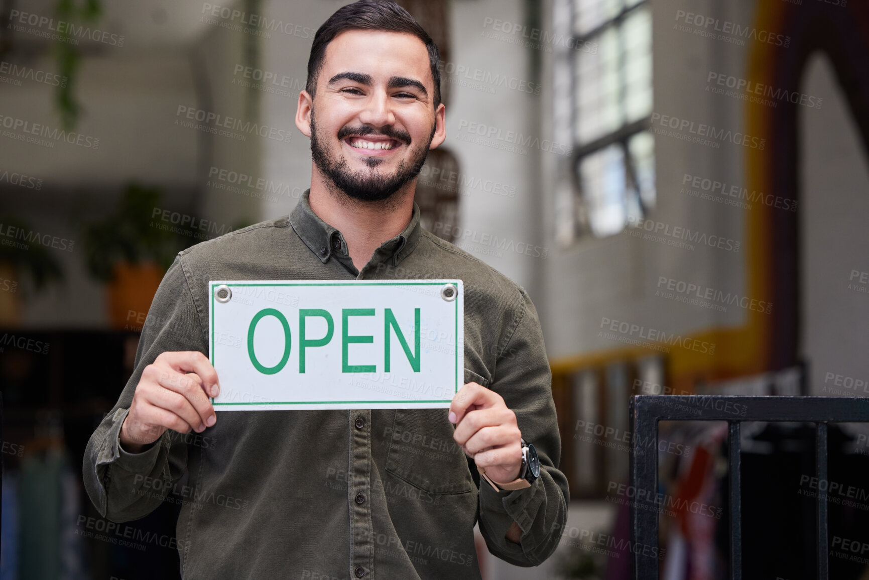 Buy stock photo Open, sign and happy business owner working in retail, store or start of service in restaurant, cafe or coffee shop. Portugal, startup and opening with a welcome, poster or smile for portrait