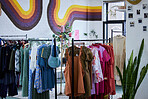 Fashion, retail and clothes in store for shopping choice, decision and option in boutique. Luxury designs, rack and display of clothing, material and textile products for sale, deal and discount