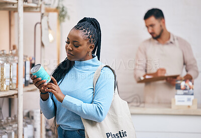 Buy stock photo Shopping, grocery store and black woman by shelf for choice, options and service in eco friendly supermarket. Small business, organic shop and customer reading label for groceries, products and food