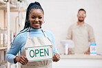 Open, sign or black woman with small business or restaurant happy for service in coffee shop, cafe or store with board. Smile, manager and portrait of entrepreneur ready for operations with billboard